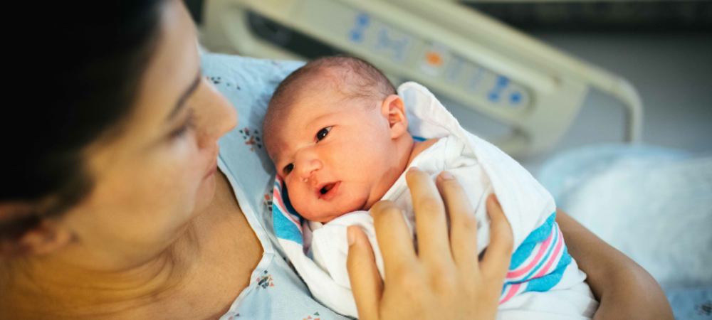 Maternal Sepsis. A Mother holds her newborn.