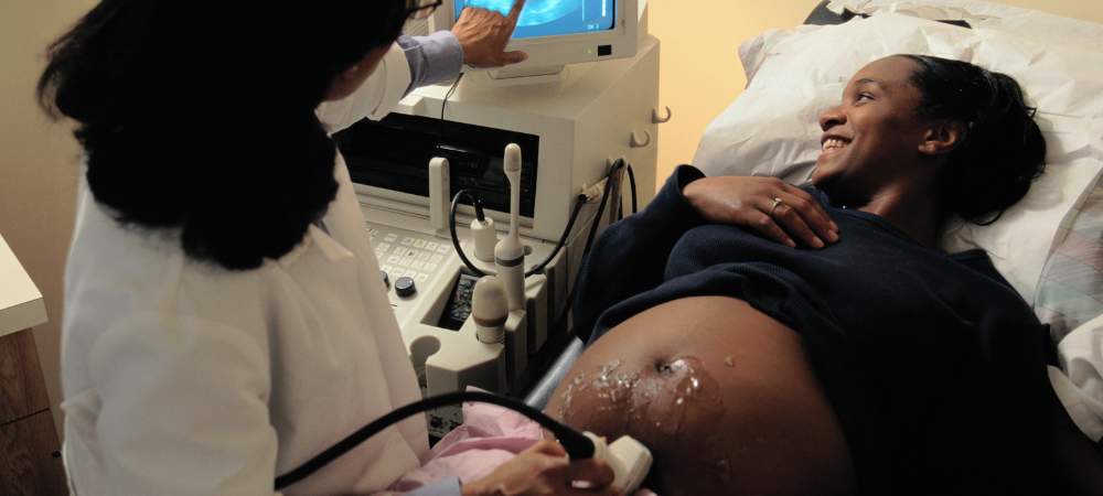 Pregnant woman receiving ultrasound