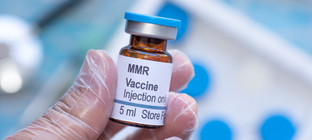Doctor holding MMR Vaccines